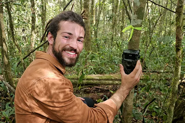 Researcher Implementing Camera Trap - Lemur Research Project
