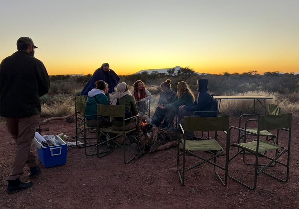 Volunteers round the campfire