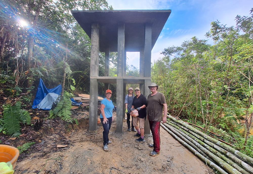 Volunteers building platform for the new orangutan island at Samboja