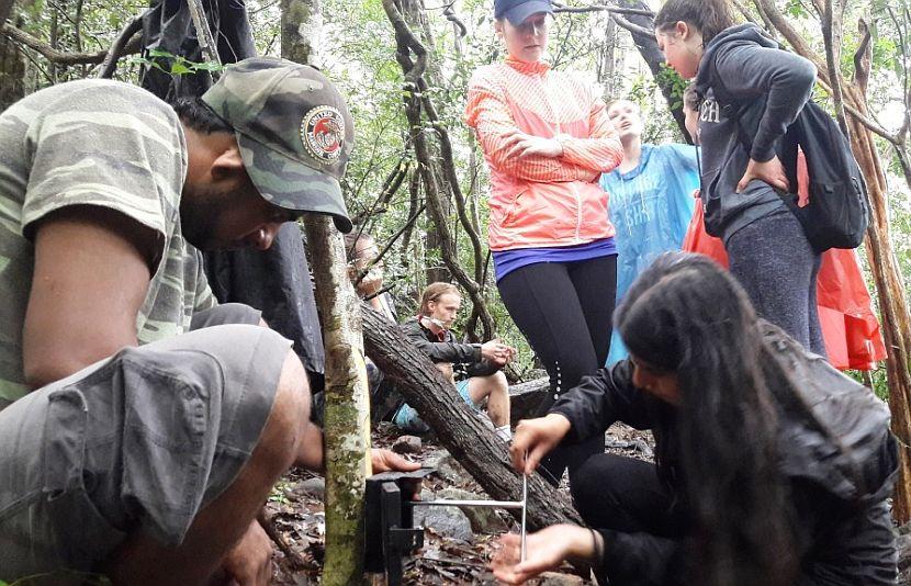 Volunteers setting up camera trap