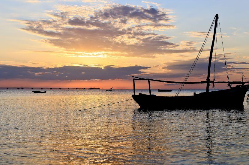 boat on the ocean in the sunset 