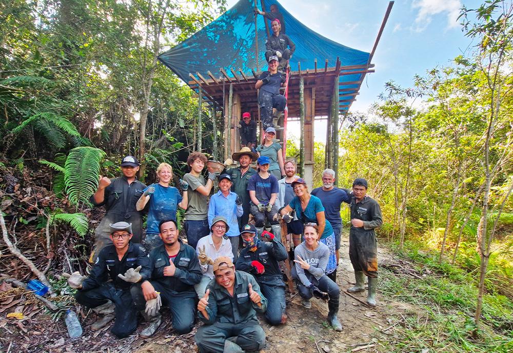 Volunteers building platform for the new orangutan island at Samboja