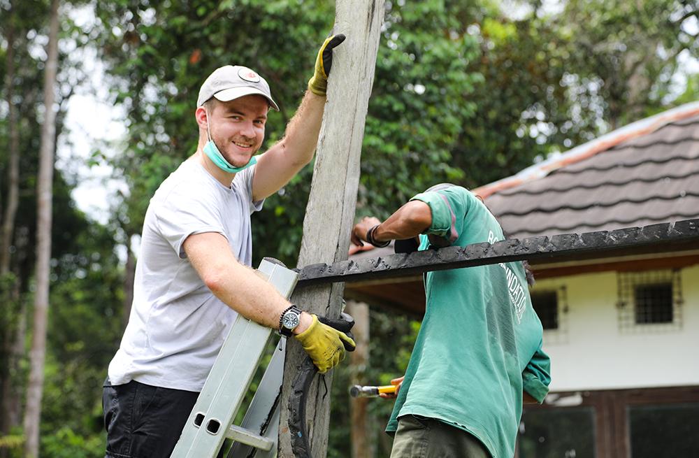 Volunteer Helping with Baby Playground