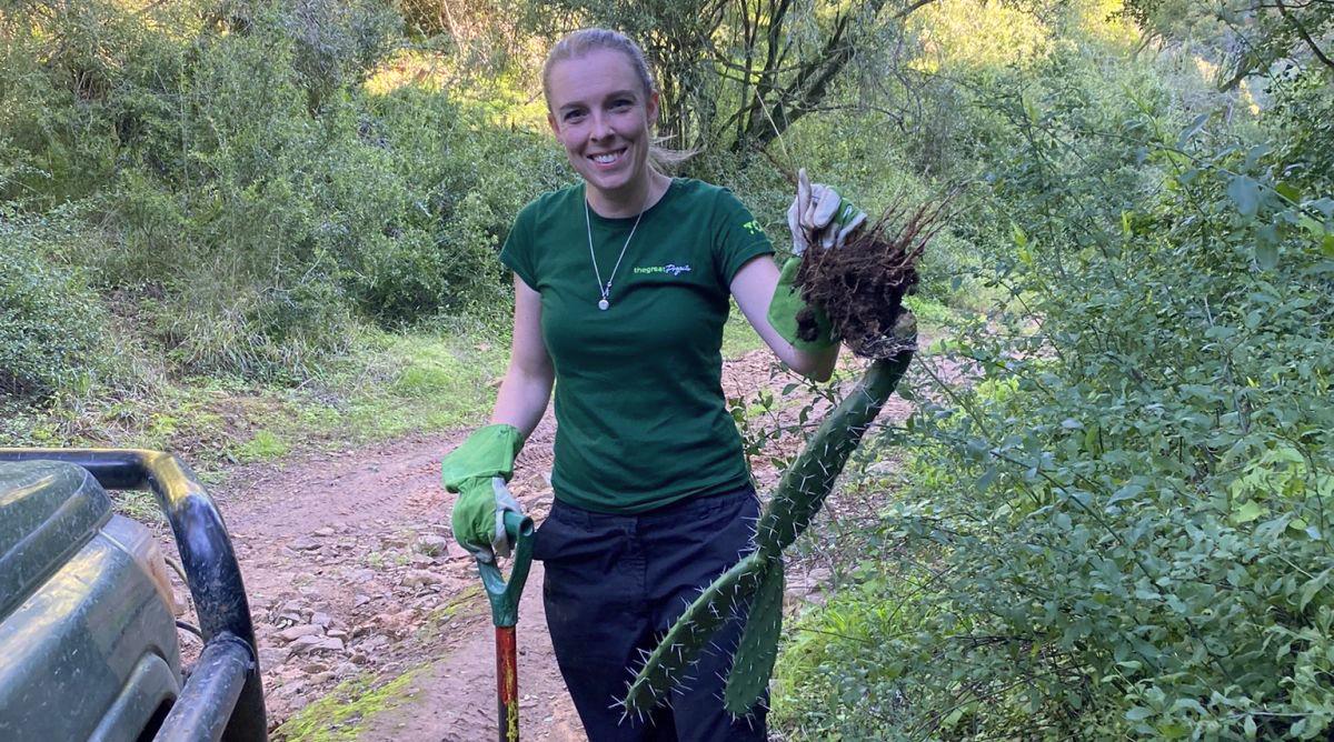 Lauren Cutting Back Invasive Plant Species